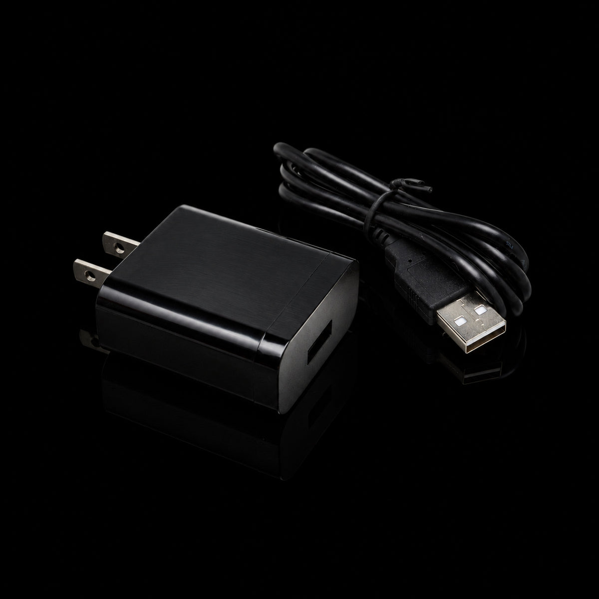 USB-C cable with wall power adapter on black