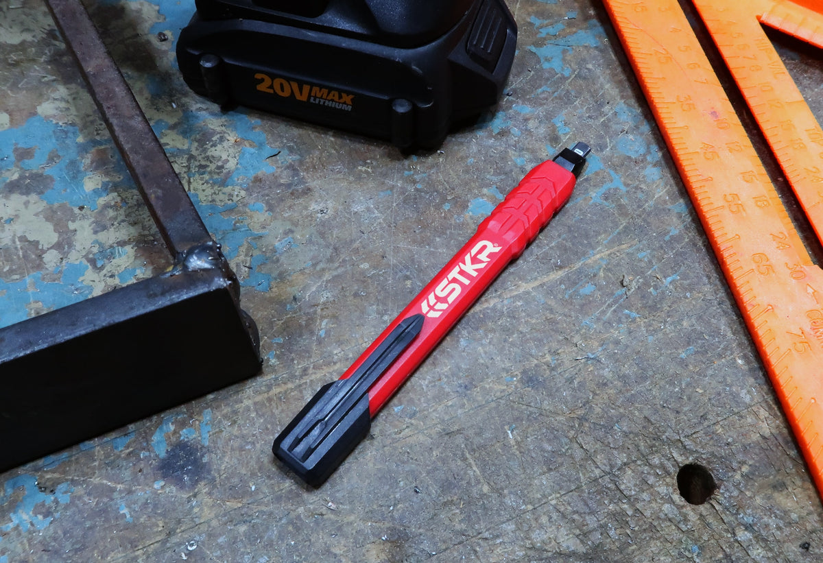 STKR Mechanical Carpenter Pencil on a concrete jobsite floor